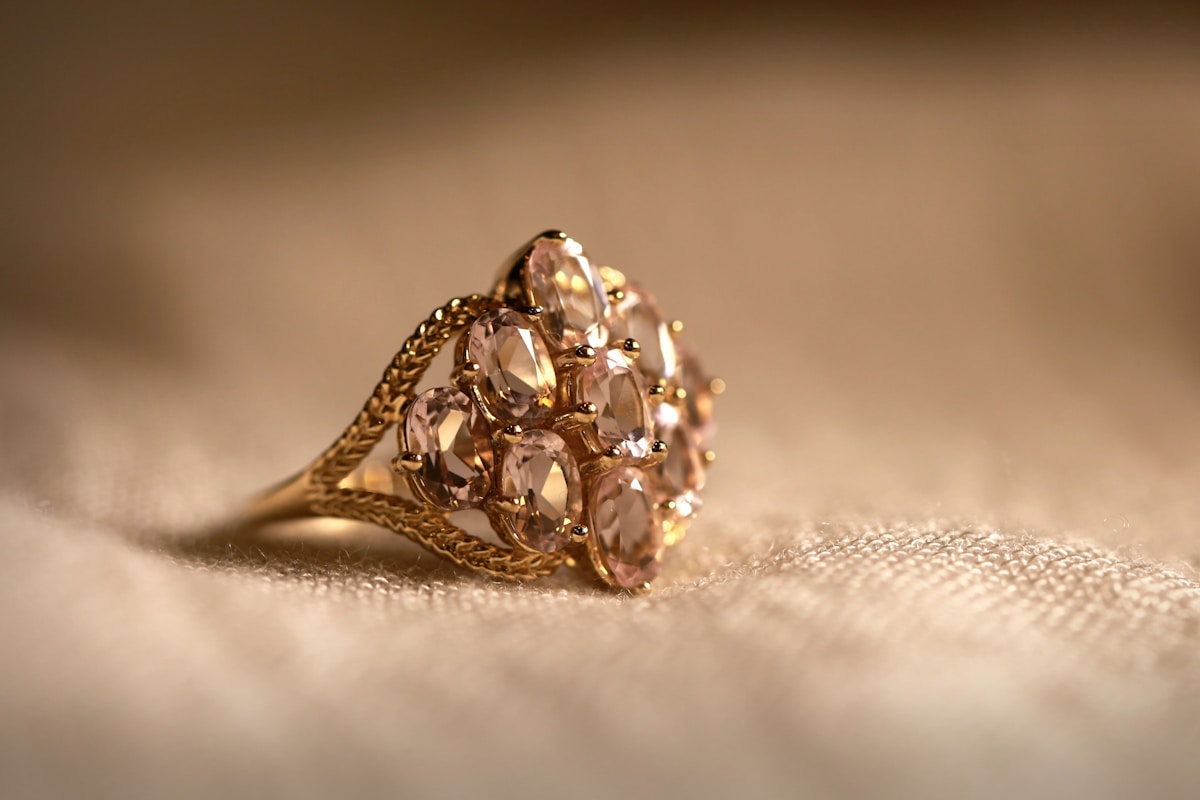A diamond solitaire ring on white textile